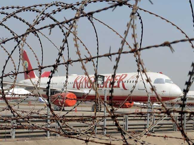 Kingfisher Airlines aircraft are seen parked on the tarmac of the Chatrapati Shivaji International Airport in Mumbai. Cash-strapped Kingfisher Airlines will remain grounded for another week after employees who have not been paid for the last seven months refused to go back to work, the company said. AFP/Punit Paranjpe Kingfisher Airlines aircraft are seen parked on the tarmac of the Chatrapati Shivaji International Airport in Mumbai. Cash-strapped Kingfisher Airlines will remain grounded for another week after employees who have not been paid for the last seven months refused to go back to work, the company said. AFP/Punit Paranjpe
